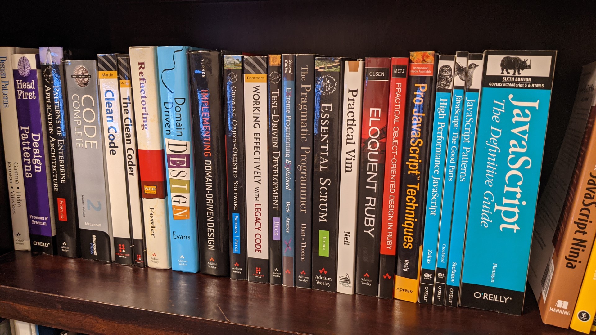 Technical books on a bookshelf